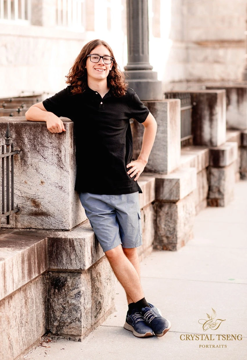 An image of Wesley in a blue polo shirt